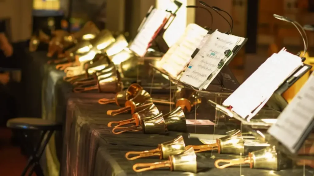 Bells and sheet music arrayed on a table